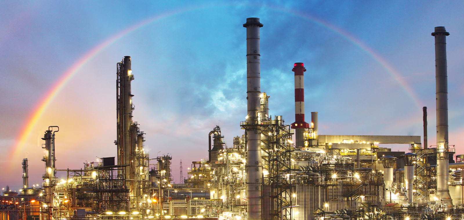 Oil indutry refinery - factory with dramatic sunset